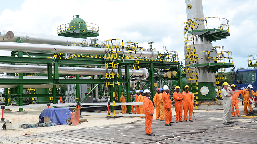Image of nnpc graduate trainees outside an oil plant